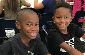  students smile at the camera